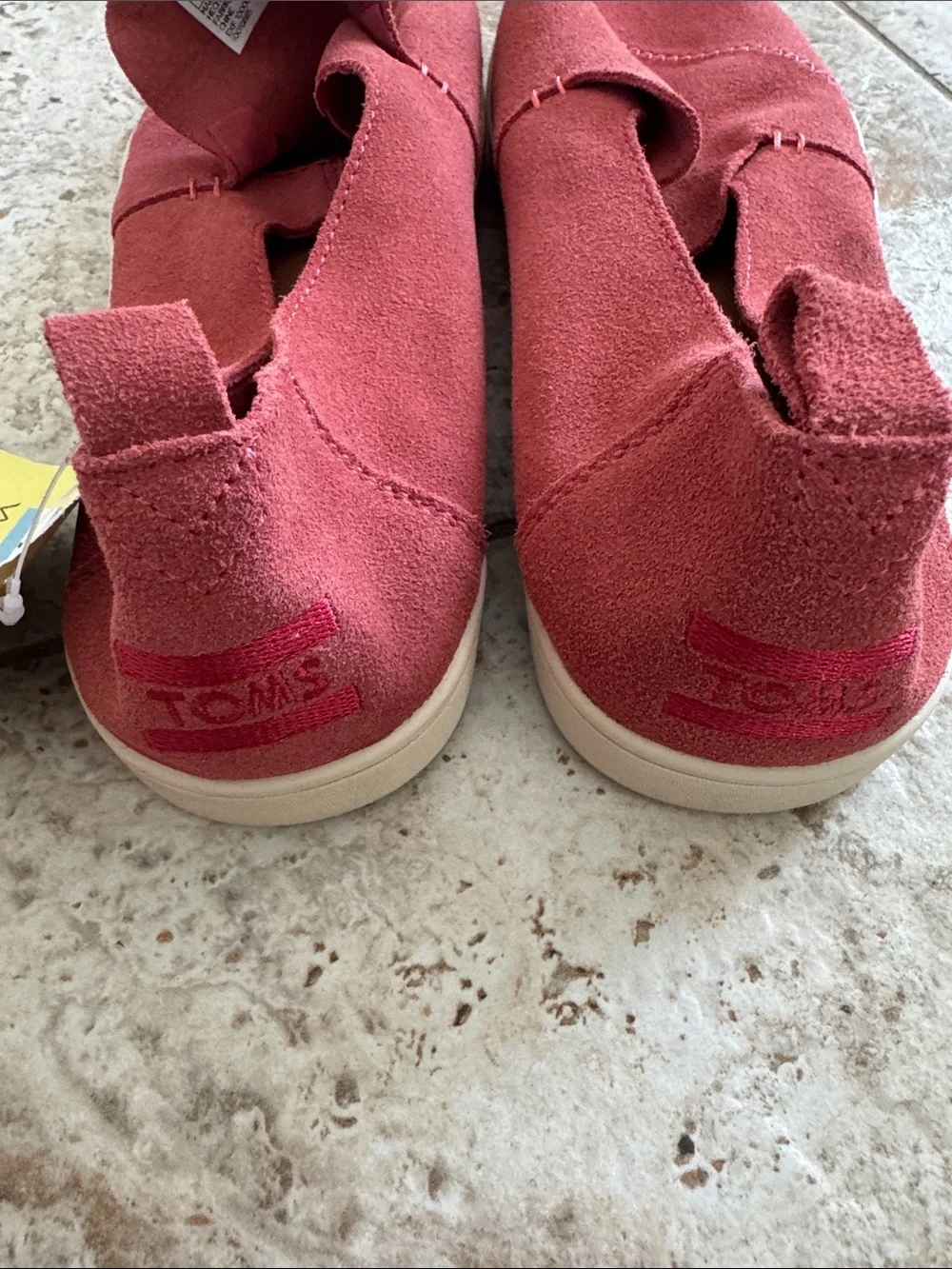 TOMS Women's Slip on sneaker style in Rust colored Red Suede